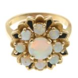 An opal and black enamel floral cluster ring.Stamped 14K.