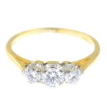 An 18ct gold diamond three-stone ring.Estimated total diamond weight 0.60ct,