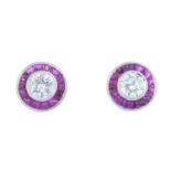 A pair of brilliant-cut diamond and ruby cluster earrings.Estimated total diamond weight 0.40ct,