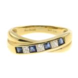 An 18ct gold sapphire and diamond ring.Estimated total diamond weight 0.20ct,