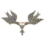 A diamond, ruby and gem-set bird brooch.Estimated total diamond weight 0.30ct.