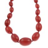 Two bakelite and resin single-strand necklaces.Lengths 62 and 90cms.