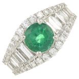 An 18ct gold emerald and vari-cut diamond dress ring.Emerald weight 1.14cts.Total diamond weight