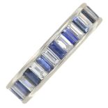 A platinum sapphire and baguette-cut diamond full eternity ring.Estimated total diamond weight