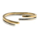 A 9ct gold hinged bangle.Hallmarks for Sheffield.Inner diameter 6.2cms.