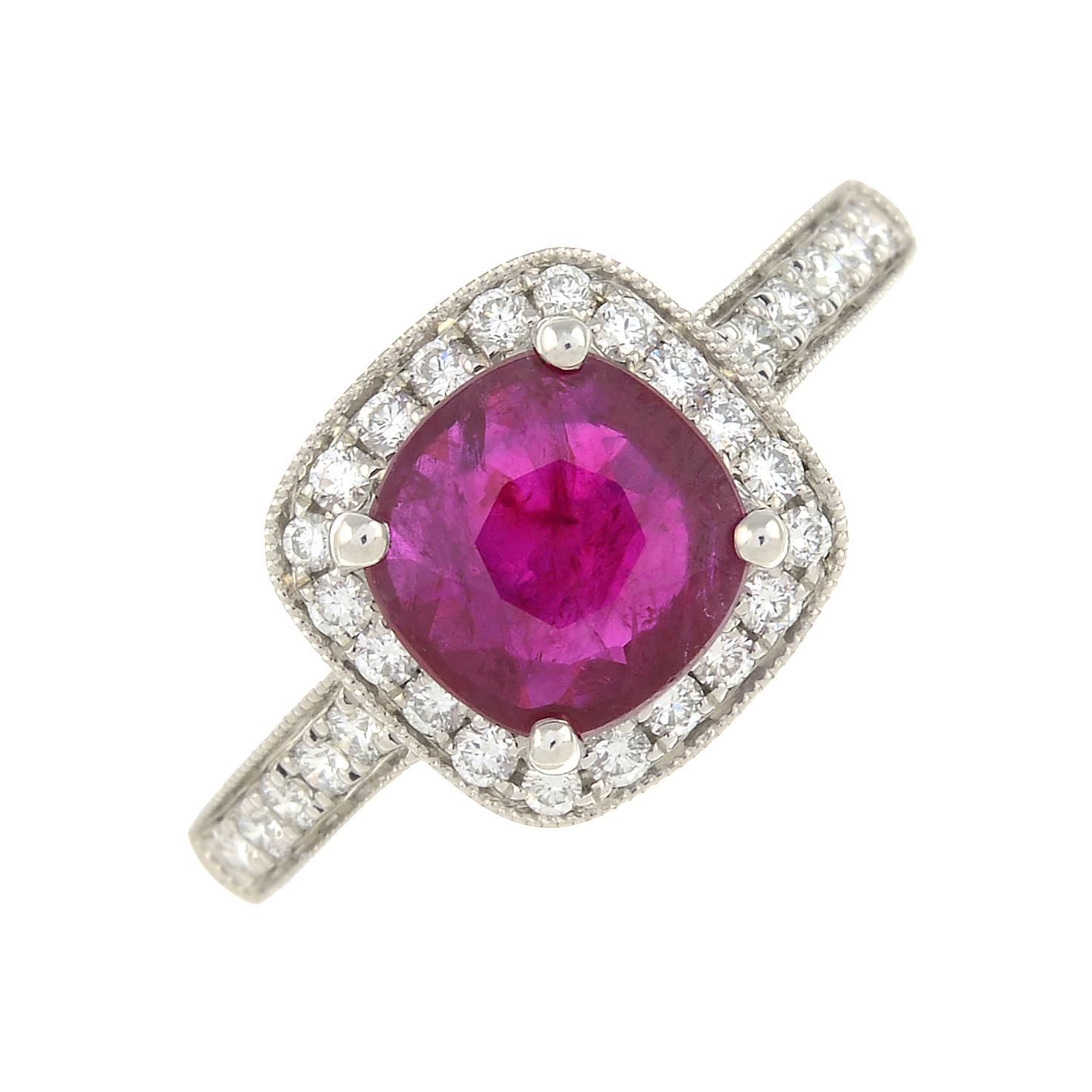 A ruby and brilliant-cut diamond cluster ring.Ruby weight 1.63cts.Diamond weight 0.29ct.Stamped