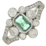 An emerald and brilliant-cut diamond cluster ring.Estimated total diamond weight 0.75ct,