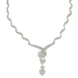 A pave-set diamond scrolling necklace,