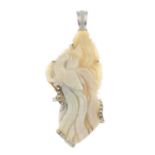 A carved opal pendant,