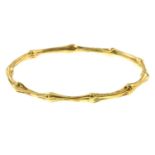 A 'Bamboo' bangle, by Tiffany & Co.Stamped 750.