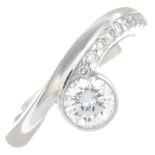 A platinum brilliant-cut diamond dress ring.Principal diamond corresponding to a report from IGI,