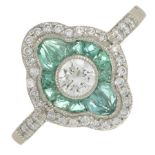 A platinum brilliant-cut diamond and emerald geometric cluster ring.