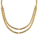 A mid 20th century 18ct gold chevron-link necklace.Stamped 750.Length 45cms.