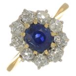 A sapphire and diamond cluster ring.With report 79231-75,