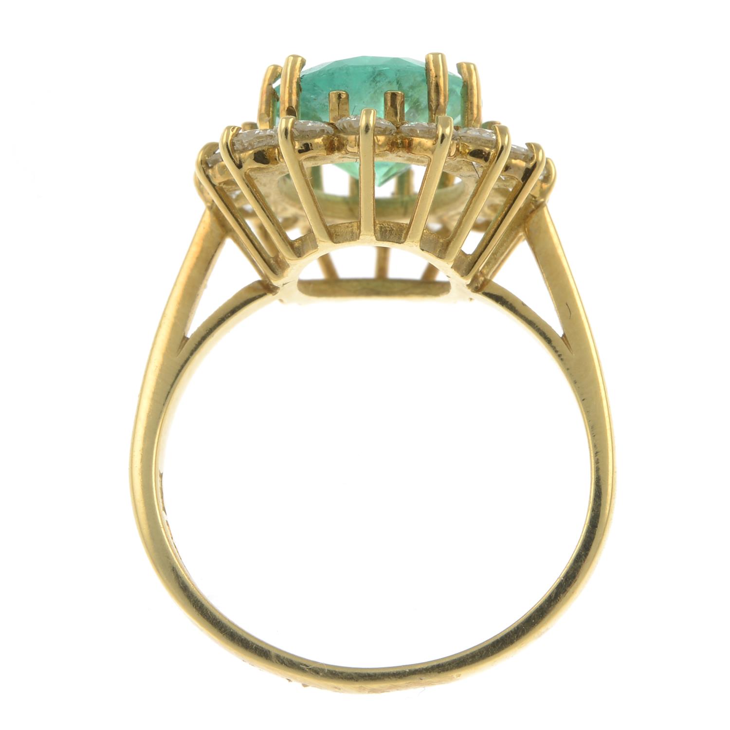 An 18ct gold emerald and brilliant-cut diamond cluster ring.Emerald calculated weight 2.88cts, - Image 2 of 3