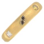 An 18ct gold vari-shape coloured diamond and diamond band ring.