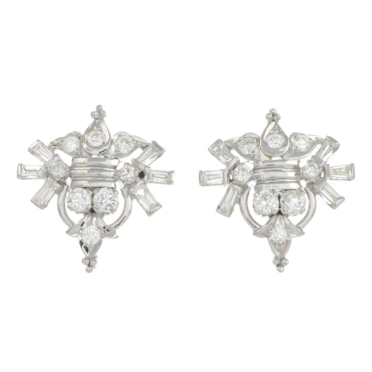 A pair of vari-cut diamond geometric earrings.Estimated total diamond weight 1ct.Length 1.8cms.