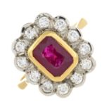 An 18ct gold ruby and brilliant-cut diamond cluster ring.Ruby calculated weight 1.69cts,