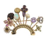 A gem-set stick pin conversion brooch.Gems include garnet,
