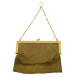 An early 20th century 9ct gold mesh purse.