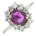 A ruby and brilliant-cut diamond cluster ring.Estimated total diamond weight 0.50ct,