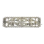 An early 20th century platinum rose-cut diamond floral bar brooch.Length 4.3cms.