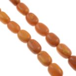 An amber bead single-strand necklace,