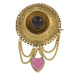 A mid to late Victorian gold garnet brooch.Length 5.7cms.