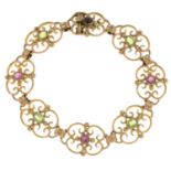 A late 19th century 15ct gold peridot and pink sapphire bracelet.Stamped 15ct.Length 18cms.