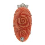 A mid 20th century floral carved coral clip, with diamond highlights.Length 3.8cms.