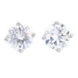 A pair of fracture-filled brilliant-cut diamond single-stone stud earrings.Estimated total diamond