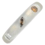 A platinum vari-cut diamond and 'brown' and 'yellow' diamond band ring.Total diamond weight
