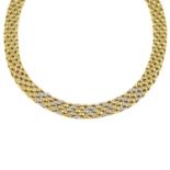 A brilliant-cut diamond bi-colour collar necklace.Estimated total diamond weight 1.30cts.Stamped