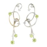 A pair of 18ct gold diamond and peridot earrings.Estimated total diamond weight 0.30ct,