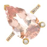 A gold morganite and diamond dress ring.