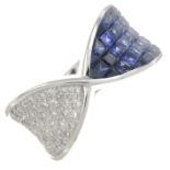 A vari-hue sapphire and diamond dress ring.Total sapphire weight 3.20cts,