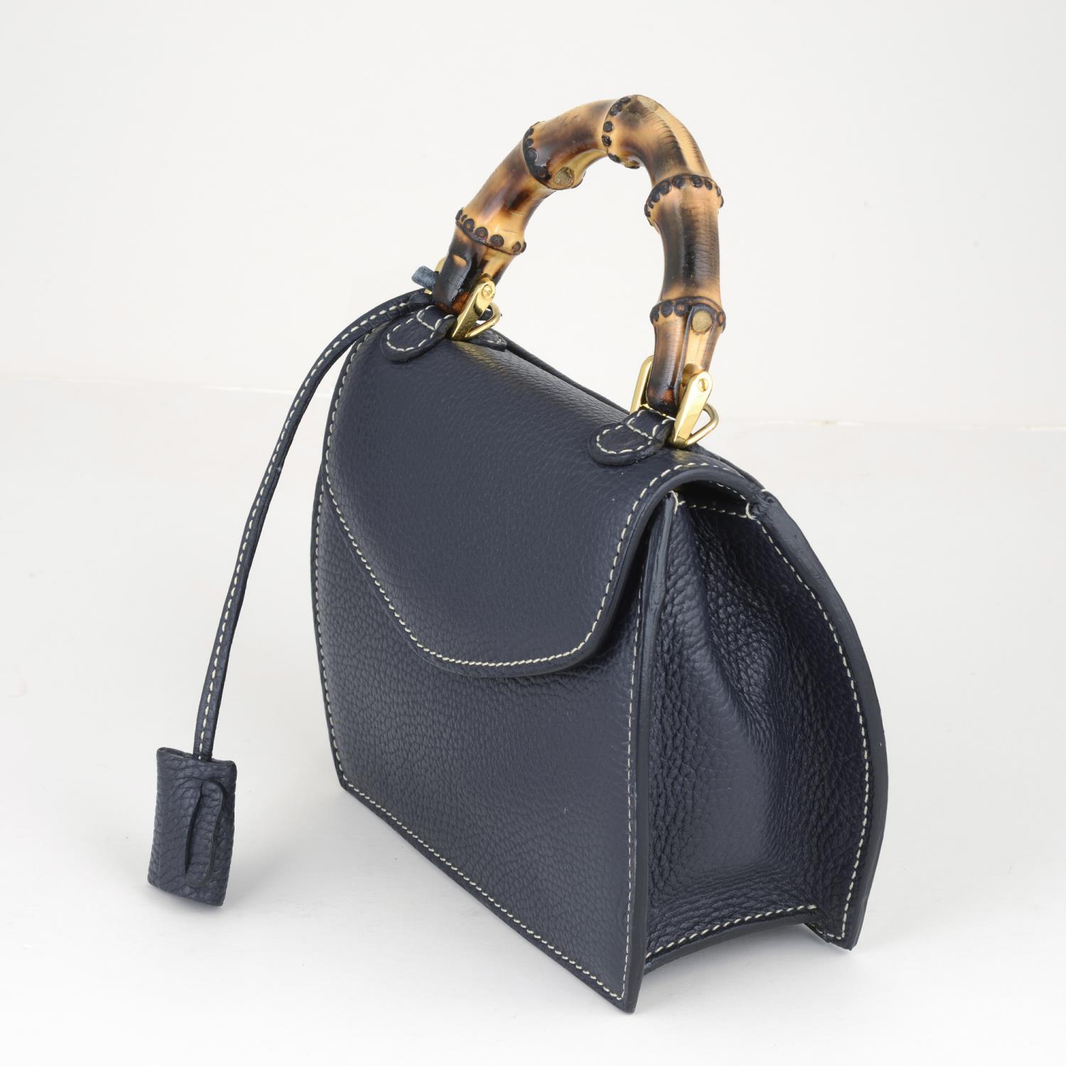 BUTI PELLETTERIE - a mini Minny navy blue leather handbag. - Image 4 of 6