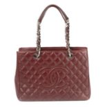 CHANEL - a burgundy Caviar Grande Shopping Tote.