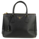 PRADA - a black Galleria Saffiano leather handbag.