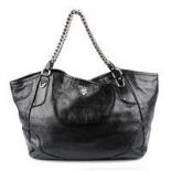 PRADA - a large black metallic leather handbag.