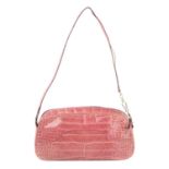 PRADA - a pink crocodile handbag.