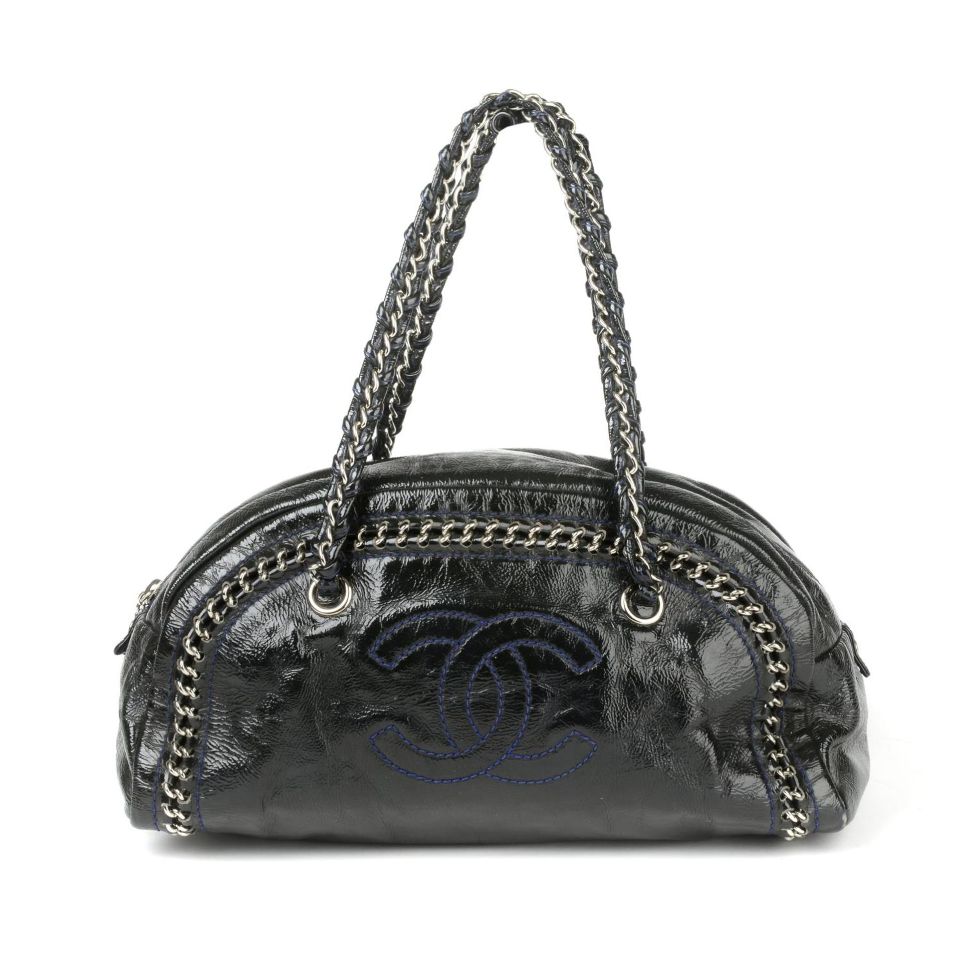 CHANEL - a Chain Trim Luxe Ligne Boston handbag.