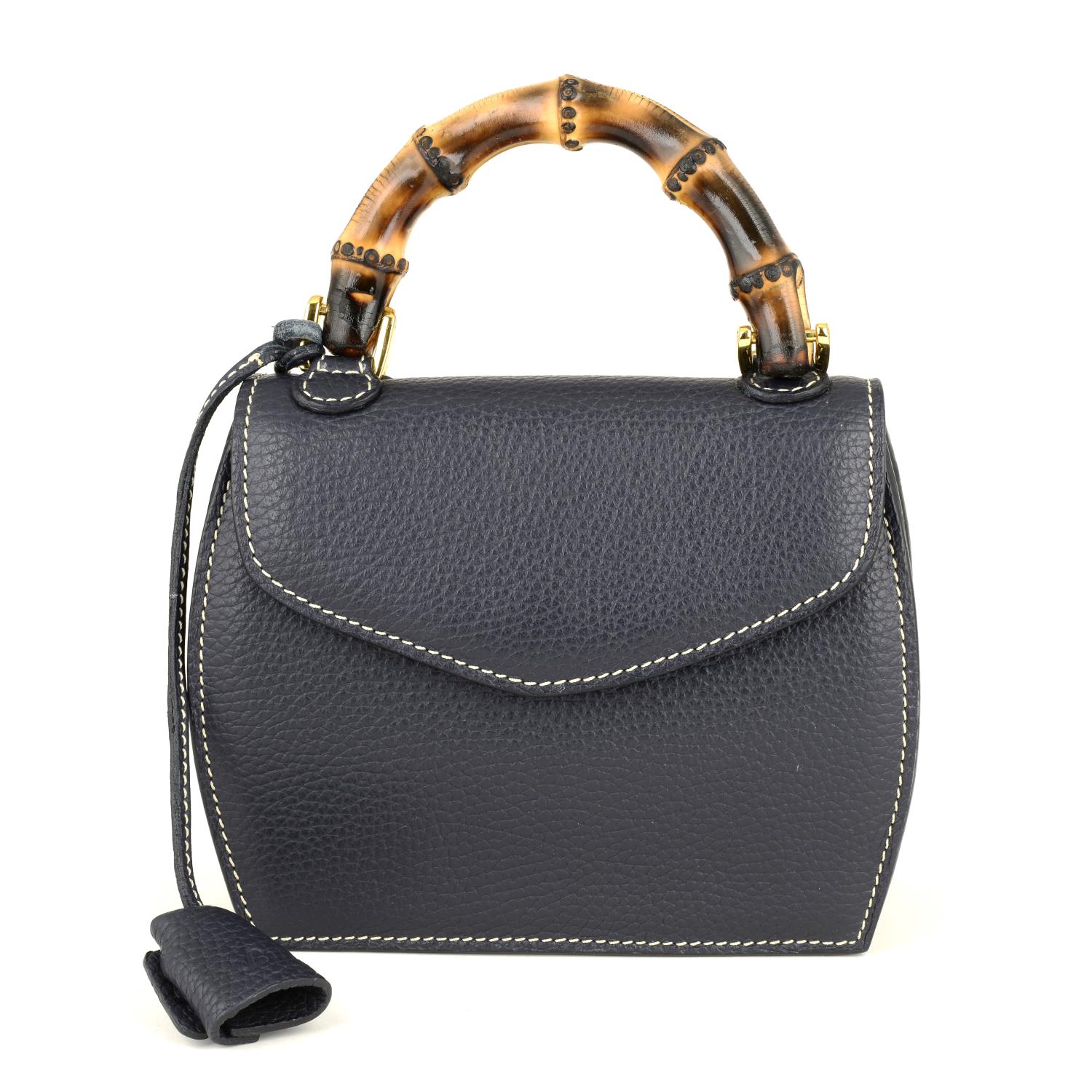 BUTI PELLETTERIE - a mini Minny navy blue leather handbag.