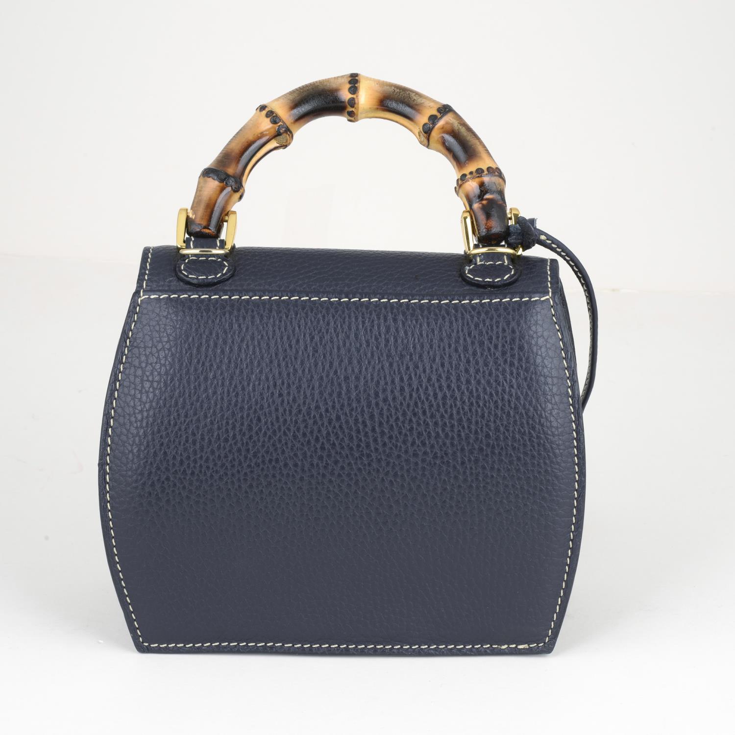 BUTI PELLETTERIE - a mini Minny navy blue leather handbag. - Image 2 of 6