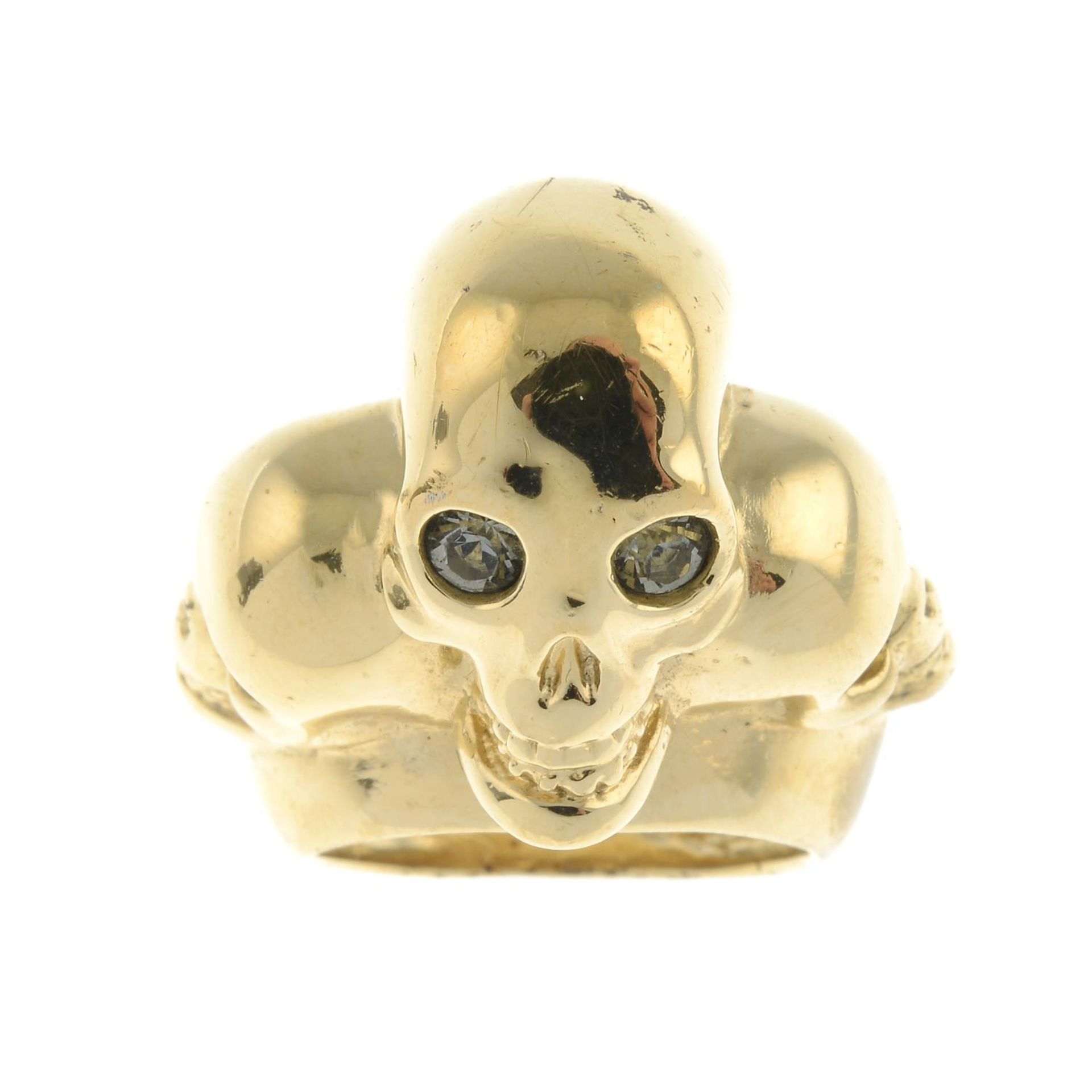 ALEXANDER MCQUEEN - a Three Skull ring.