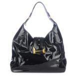 OSCAR DE LA RENTA - a black patent lather handbag.