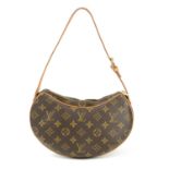 LOUIS VUITTON - a Monogram Croissant PM handbag.