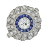 A platinum sapphire and brilliant-cut diamond dress ring.Total sapphire weight 0.70ct.Total diamond