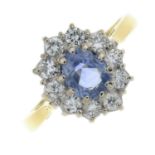 An 18ct gold sapphire and brilliant-cut diamond cluster ring.Estimated total diamond weight 0.40ct,