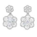 A pair of 18ct gold brilliant-cut diamond floral cluster drop earrings.Estimated total diamond